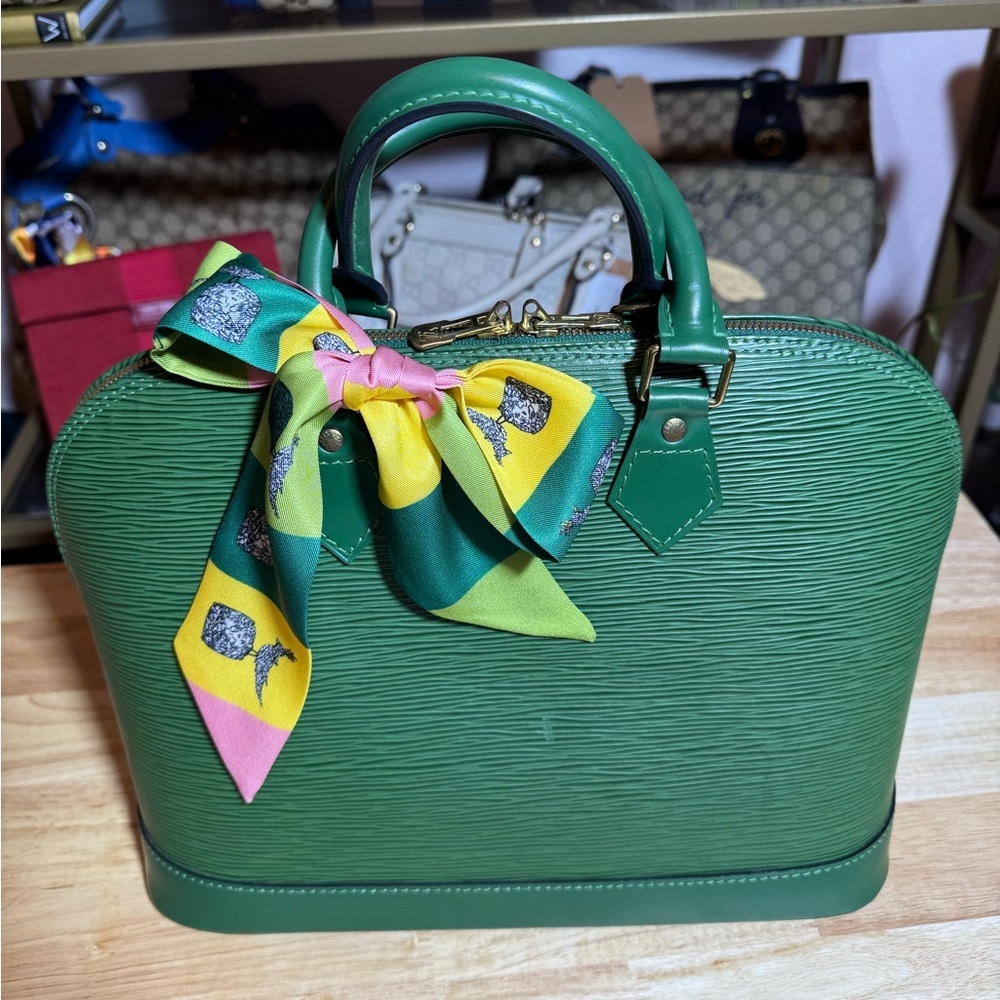 SOLD
Green Louis Vuitton Alma Handbag
